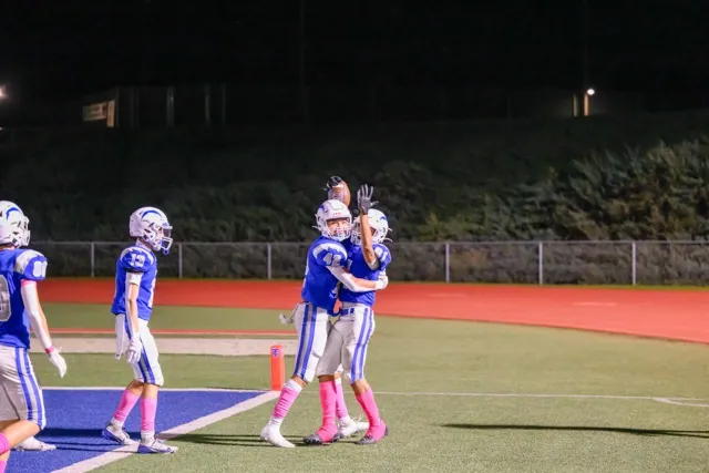 Temescal Canyon’s #81 Aaron Boessler wraps around the corner for a long TD