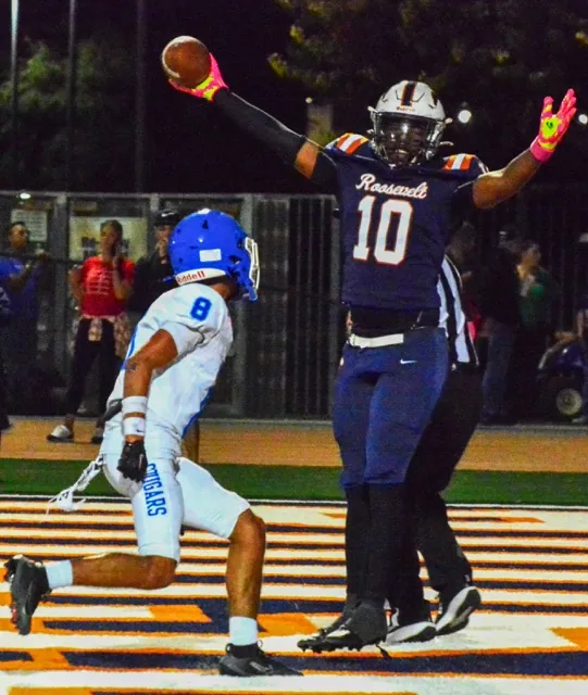 Features Photos 10-17-2025. Eastvale Roosevelt’s Josh Dailey (10) celebrates his touchdown catch from a jump pass thrown by running back Aidan Quintanar while Norco’s Johnny Salazar (8) watches. That was the last score for the Mustangs as the Cougars won the game 50 – 14.