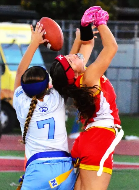 Still competing, Norco’s Jadyn Killeen (7) and Corona’s Isabella Acosta (8) fight for a pass on the second-to-last play of the game.