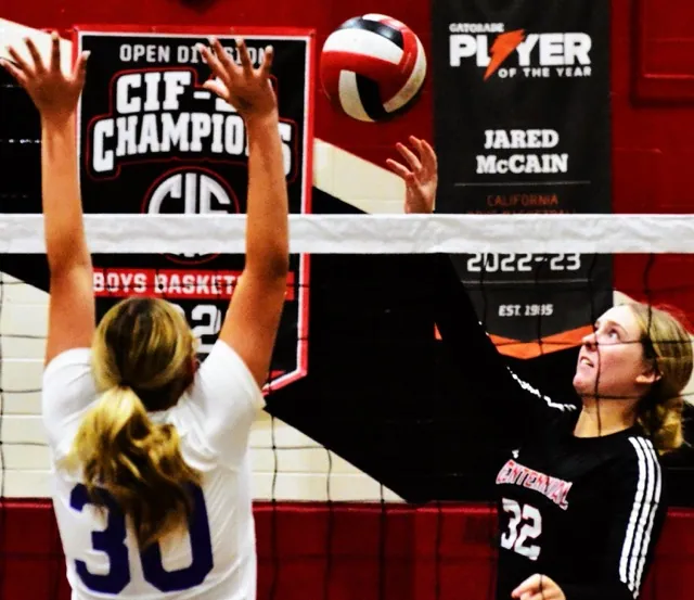 Norco’s Natasja Fairbanks (30) tries to block a dink over the net by Corona Centennial’s Katie Tolsma (32).