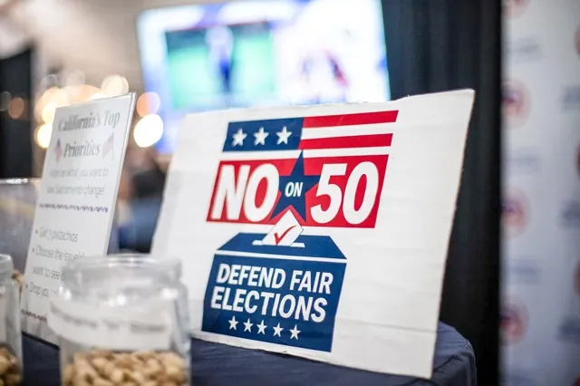 A “No on Prop 50” sign at the Kern County Republican Party booth at the Kern County Fair in Bakersfield on Sept. 26, 2025.
Credit: Photo by Larry Valenzuela, CalMatters/CatchLight Local