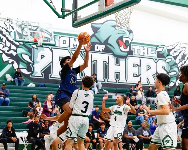 JW North’s #33 Vera Oliver takes off but gets hit with a charging foul thanks to set player #3 Rui Galindez