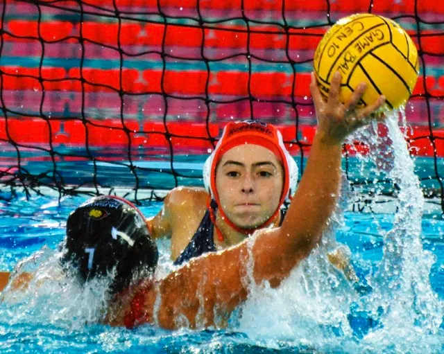 Eastvale Roosevelt goalie Aly Casteneda eyes Centennial’s Jayda Perez (7) as Perez winds up for a shot on goal during the Huskies’ 21 – 6 victory over the Mustangs.