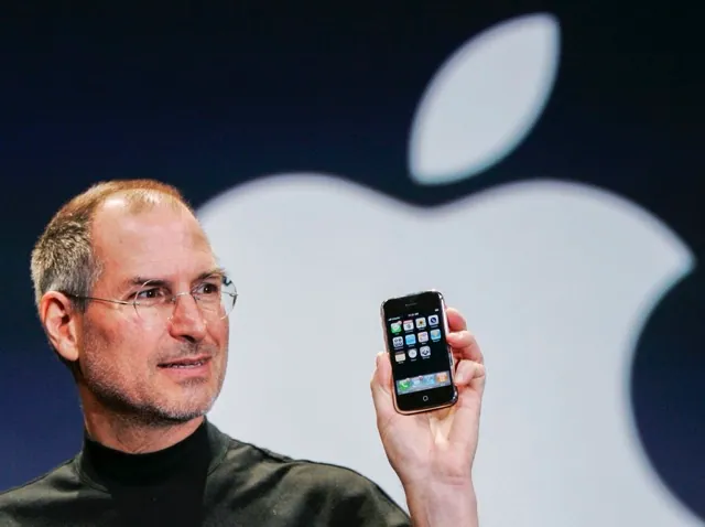 January 9. Apple CEO Steve Jobs holds up an Apple iPhone at the MacWorld Conference in San Francisco, in this Jan. 9, 2007 file photo. Credit: AP Photo/Paul Sakuma