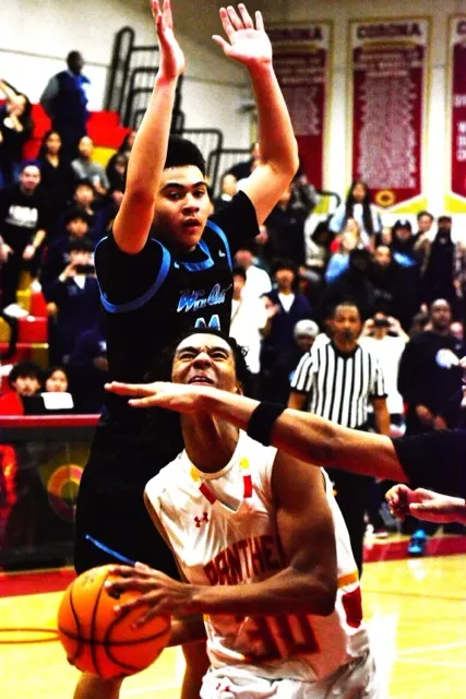 Walnut’s Jacob Ventura (top) gets ready to lower the boom on Corona’s Christian Wilson’s (30) layup attempt.
