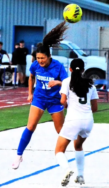 Norco’s Toni Backus (15) has the header bounce away while Sage Hill’s Sydney Patel (9) defends. The Lightning defeated the Cougars 4 – 0 in the first round of the CIF playoffs.