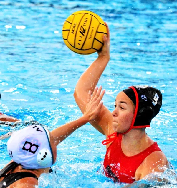 Centennial’s Emma Armstrong (9) fires in a scoring shot against Aliso Niguel’s Shellby Cooney (8). Credit: Photo by Gary Evans