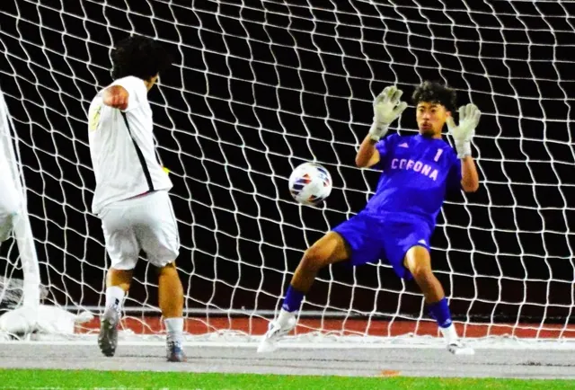 Corona goalkeeper Chris Salazar blocks a Canyon shot.