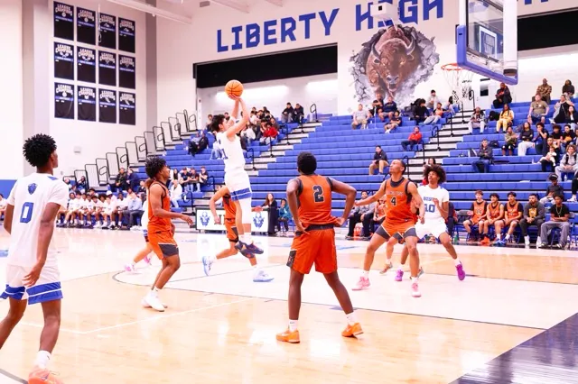 Liberty’s #21 rises up on a middy to get an uncontested bucket
