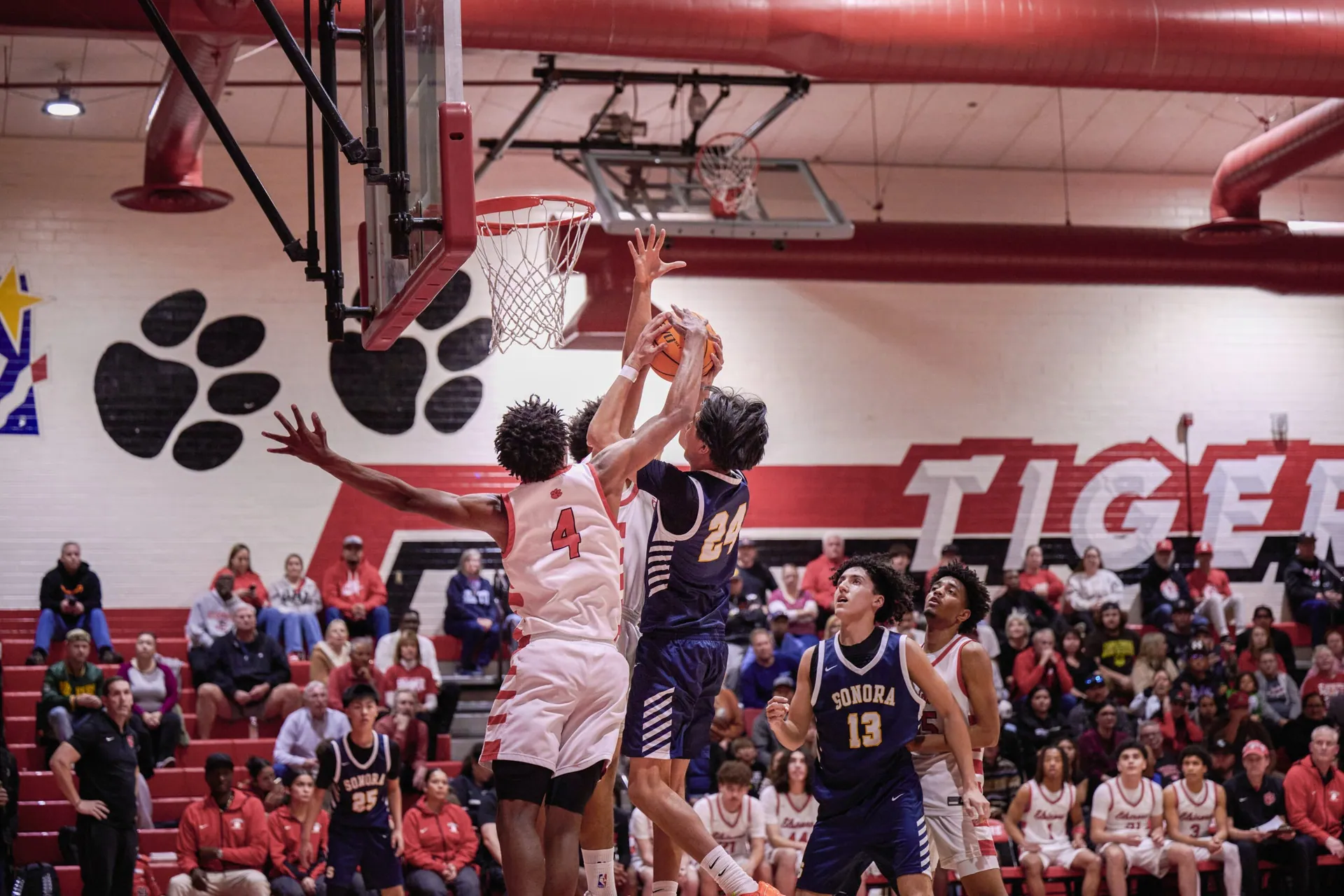 Elsinore plays the Hesperia Scorpions tonight. Tigers #4 Nasir Bates blocks Raiders #24 Jacob San Martin. Photo by Marcus Walker