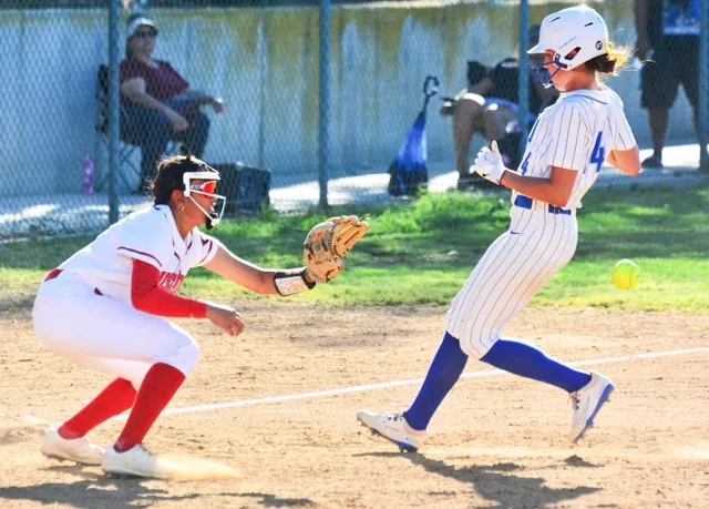 Norco’s Leighton Gray (14) reaches third base standing as Centennial’s Mia Chung awaits the late throw.