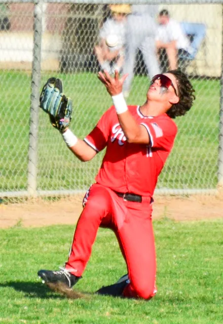 Centennial’s Jesse Mendoza races in from left field to make a sliding, juggling catch on a pop-up by Norco’s Zach Fielder. The Huskies jumped out to a 4 – 0 lead in the top of the second. Norco got two in the bottom of the second, tied the game in the fourth, and scored four more in the sixth to win 8 – 4.