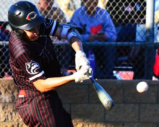 Centennial’s Christian De La O smacks a single to center field.