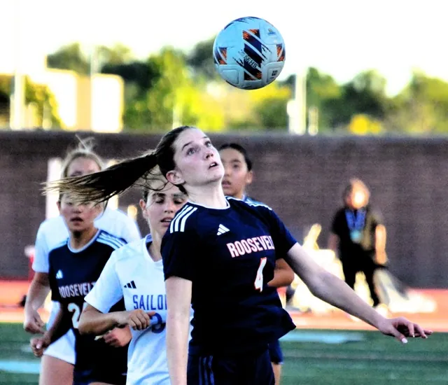 Eastvale Roosevelt’s Brooklyn Musser (4) heads the ball towards the Newport Harbor goal during the second half of the Mustangs’ 1 – 0 CIF Division 1 Championship game victory