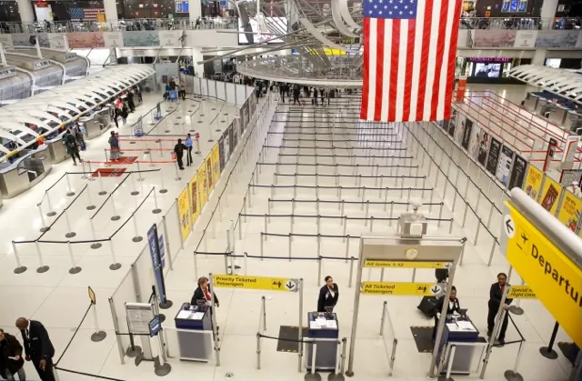 March 13. The area for TSA screening of travelers at JFK airport's Terminal 1 is relatively empty, Friday, March 13, 2020, in New York. President Trump banned most Europeans from entering the United States to try to slow down the spread of the spread of the virus. Credit: AP Photo/Kathy Willens