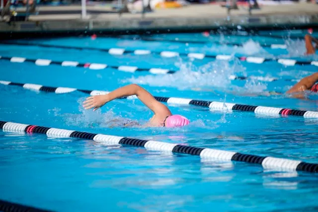 A Liberty High swimmer maintains a strong stroke and steady cadence during the freestyle event.