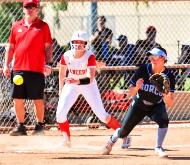 Norco third baseman Sadie Burroughs snares a line drive for the out in the Cougars 2 – 0 win over Orange Lutheran.