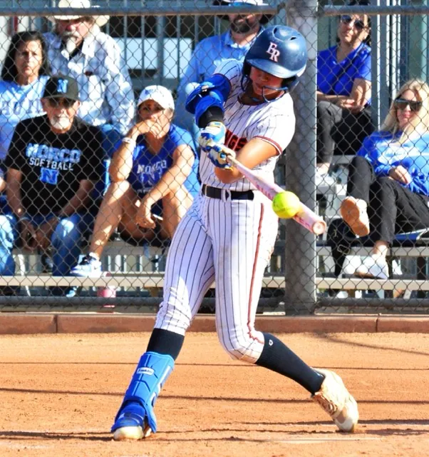 Eastvale Roosevelt’s Aubrey McLaughlin hammers a home run against Norco, accounting for the Mustangs lone run in the Cougars 15 – 1 win.