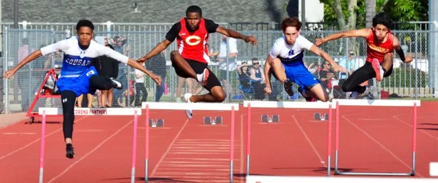 Norco’s Kadyn Camacho, Corona’s Christian Rios, Norco’s Jesse Diaz, and Corona’s Jesse Gonzalez race in the 300 Hurdles. Diaz took first at 45.37, Rios second at 46.83, Camacho third at 47.26, and Gonzalez fourth at 49.02.