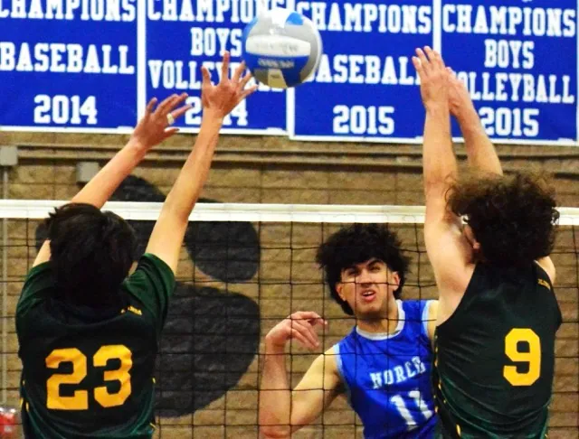 Norco’s Layne Maalona (11) gets a shot between Brea-Olinda’s Jacob Sim (23) and Ivan Haluska (9) during the second round of the CIF playoffs. The Wildcats defeated the Cougars 3 – 1.