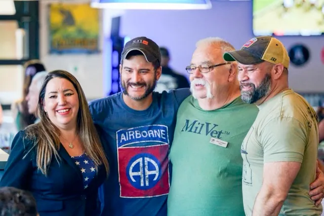 MilVet President Raven Hilden, left, stands with Purple Heart recipients Jared Lemon, second from left, and Bobby Carrasquillo Jr., right, along with MilVet volunteer Lee Cooper, second from right at an event to raise $10,000 for them to parachute at the 82nd anniversary of the Battle of Normandy, also known as D-Day. The event was co-hosted with VAREP Temecula Valley Chapter and held at The Cove Bar and Grill in Murrieta.