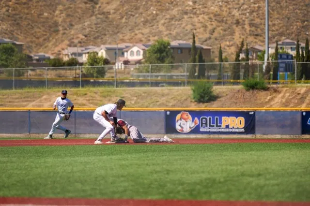 Riverside Prep #8 Trent Bourgeios beats the thrown and slides into second base on a hit