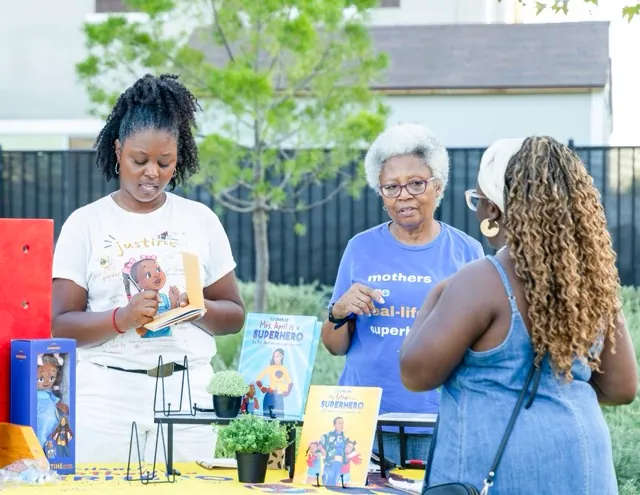 Author, C.J. Charles, left, and her mother, held a reading and signing of C.J.’s book, “My Mother is a Superhero,” sponsored by Jah Jah’s Juice Garden in Menifee, August 22.
