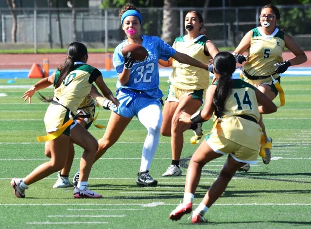 Norco’s Neila Cooke (32) returns an interception while five Lakeside players, including Karina Hernandez (5) and Lindsay Gaxiola (14), give chase.