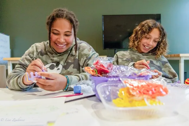Gracie (L) and Lili (R) make bracelets during the Crafting Corner at the Menifee Library, Saturday August 8. 
Credit: Lisa Zambrano