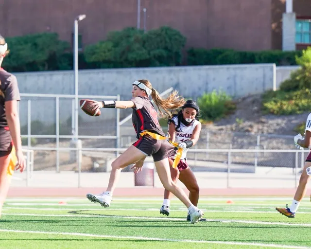 Paloma Valley’s #16, Paige Barron, pulls the flag of Murrieta Valley’s #40 during a nonleague girls flag football game