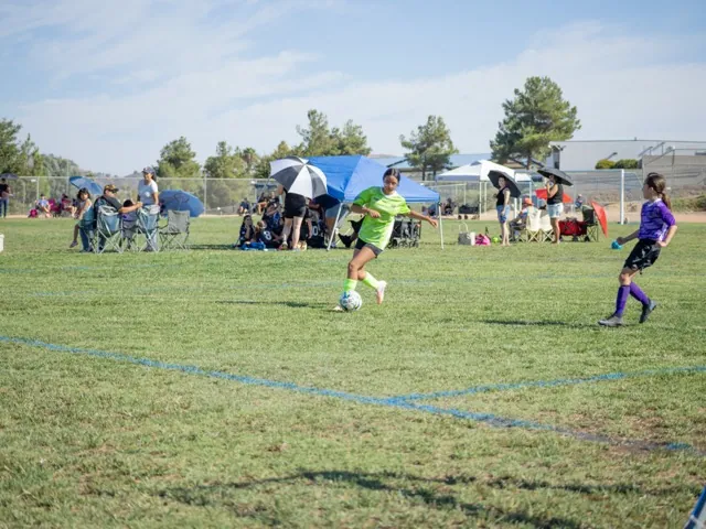 AYSO is back in full swing in Southern California. Giselle Gonzalez drives the ball on the attack. MIDDLE: The Toxic Fury score a goal on their way to defeating the Purple Panthers 4-0 in the 12UG Murrieta Region 1463 opener. RIGHT: The parent tunnel is a beloved tradition for the players.