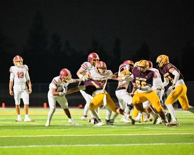 Colton RB Isaiah Garcia #8, breaks a tackle to keep the ball moving on a run outside the tackles