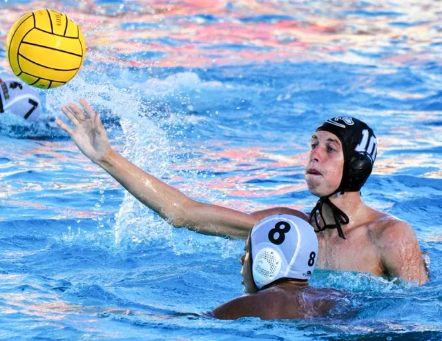 Corona’s Zach Bonnera (10) fires a shot on goal while Schurr’s Cuauhtli Dominguez (8) defends.  The Panthers defeated the Spartans 14 – 4.