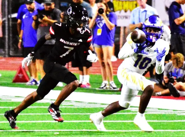Corona Centennial defender Augus Sanders (7) watches Rancho Santa Margarita receiver Kiyan Callis (10) eye the catch during the Eagles’ win.