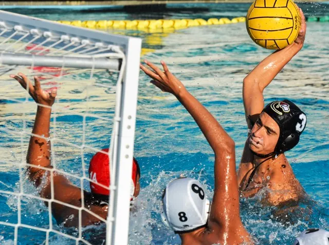Corona’s Michael Burke (3) is about to score against Schurr goalie Aiden Luna (1A) and Cuauhtli Dominguez. 