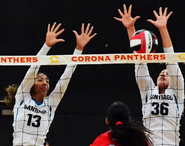Santiago’s Brooklyn Dye (13) and Maddie Siqueland (36) try to block a Corona shot during the Sharks 3 – 0 win over the Panthers.