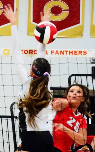 A Santiago player fails to block Corona’s Khloe Ishii’s (25) shot. 