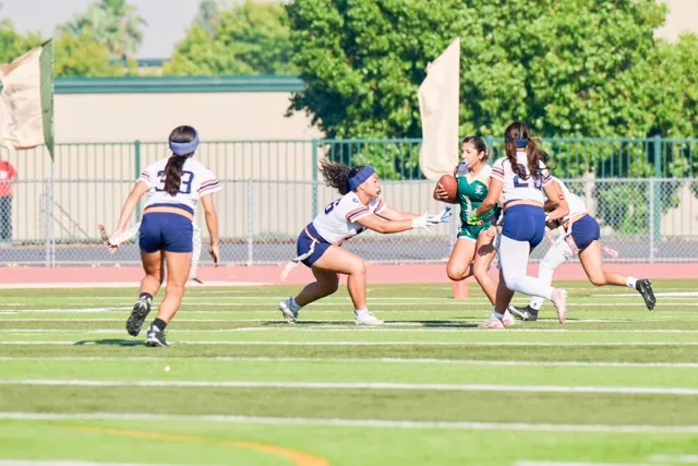 Roosevelt defenders, including Siddalee Plyer #23, left, and Madeline Leyva #25, converge on a Lakeside ball carrier, Christina Barajas #1, during a designed run for minimal yards