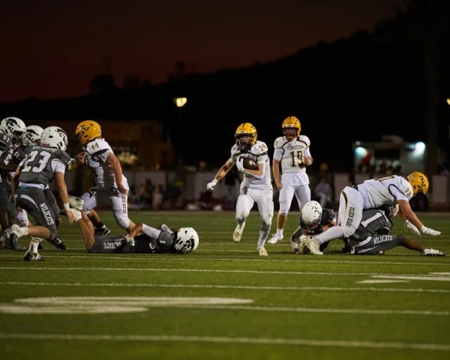 Temecula Valley’s Running Back, Devon Krause #24, has a large open gap to run through thanks to the Offensive line. 