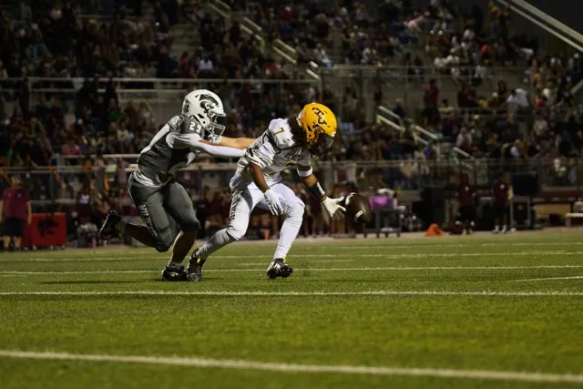 Temecula Valley’s Jermel Bryant Jr. #7, fumbles a designed Halfback screen play. He and Paloma Valley’s Trajan Cass #29,  scramble to make the recovery.