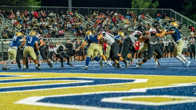 Featured Photos 10-09-2026. Corona Centennial’s running back, Kennie Leggett (#19), maintains his balance on his way to cross the goal line. Leggett ran for 55 yards and the TD in 10 carries as the Huskies opened league play with a dominant 65-14 win.