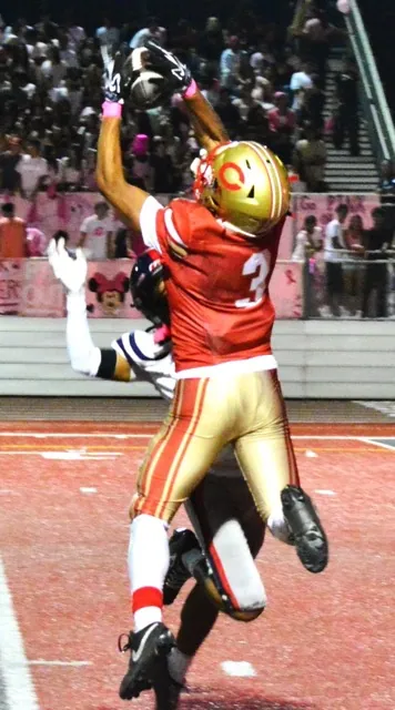 Paloma Valley’s Eunice Defro (#13) battles against double coverage but can’t come up with the reception
