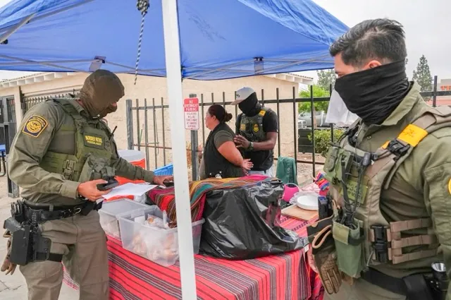 Immigration Agents. A woman is detained by U.S. Border Patrol agents outside a Home Depot in Los Angeles on Aug. 15, 2025. Credit: Photo by Gregory Bull, AP Photo