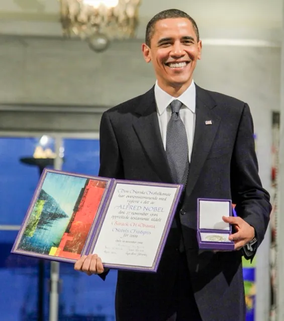 October 9. In this Dec. 10, 2009, file photo, President and Nobel Peace Prize laureate Barack Obama poses with his medal and diploma at the Nobel Peace Prize ceremony at City Hall in Oslo. Seven years ago Obama won the Nobel Peace Prize. On matters of war and peace, Obama has proven to be a confounding and contradictory figure, one who stands to leave behind both devastating and pressing failures, as well as a set of fresh accomplishments whose impact could resonate for decades. Credit: AP Photo/John McConnico
