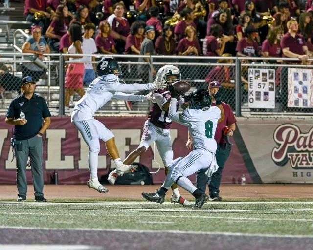 Paloma Valley’s Eunice Defro (#13) battles against double coverage but can’t come up with the reception