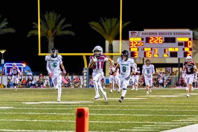 Paloma Valley’s Askari Richardson (#11) breaks into the open field and races for a touchdown. The Paloma Valley Wildcats ran away with the game defeating the Perris Panthers, 46-0.